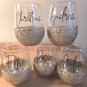 Personalized stemless wine glass with glitter-dipped bottom half, customized with any name for bridesmaids, birthdays, and special events.