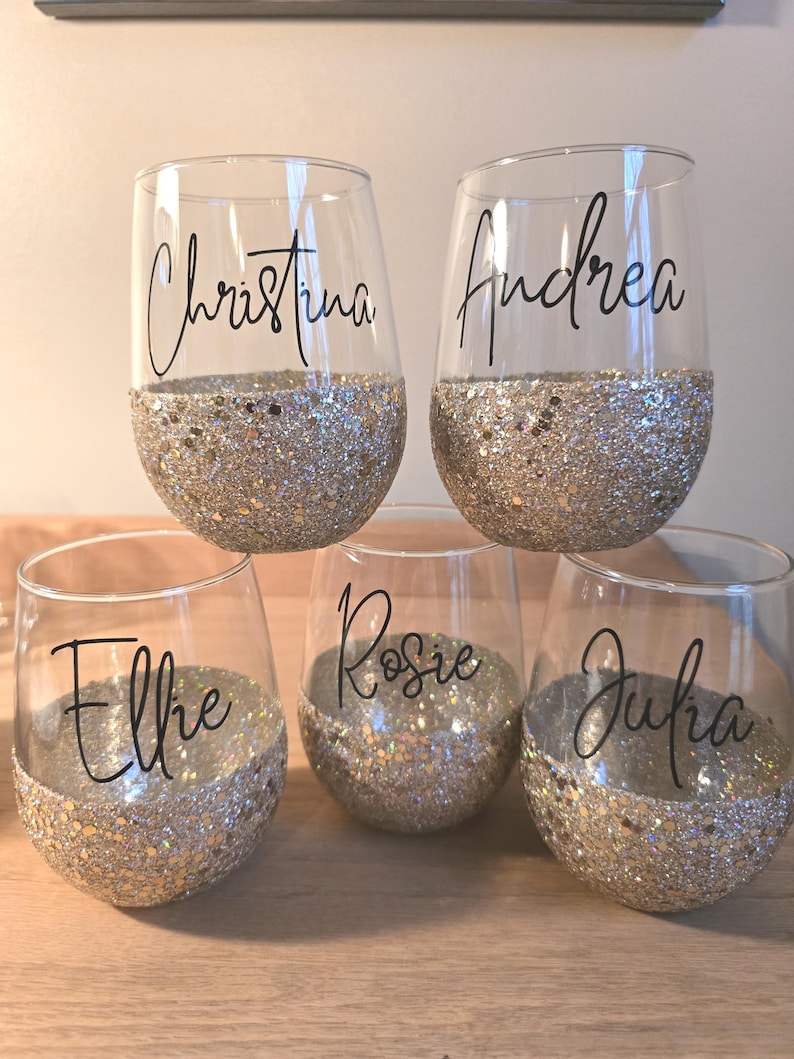 Personalized stemless wine glass with glitter-dipped bottom half, customized with any name for bridesmaids, birthdays, and special events.