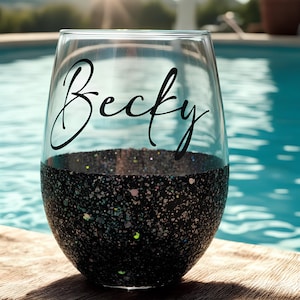 Personalized stemless wine glass with glitter-dipped bottom half, customized with any name for bridesmaids, birthdays, and special events.