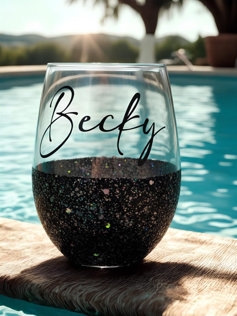 Personalized stemless wine glass with glitter-dipped bottom half, customized with any name for bridesmaids, birthdays, and special events.