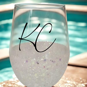 Personalized stemless wine glass with glitter-dipped bottom half, customized with any name for bridesmaids, birthdays, and special events.