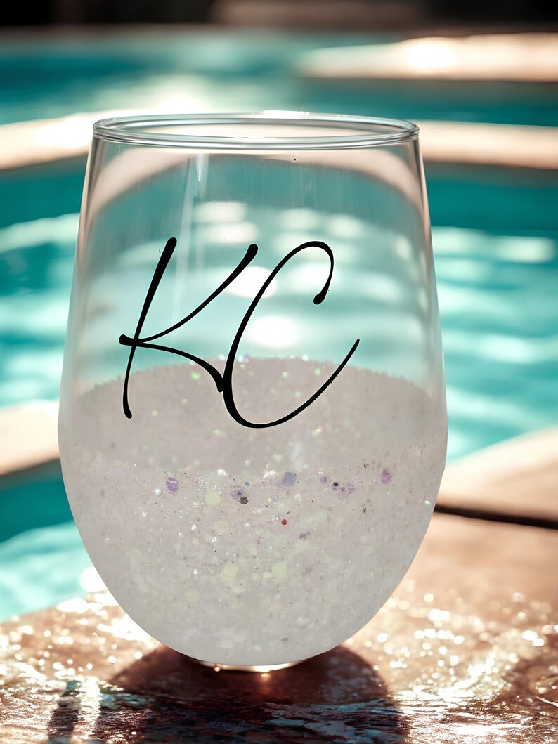 Personalized stemless wine glass with glitter-dipped bottom half, customized with any name for bridesmaids, birthdays, and special events.