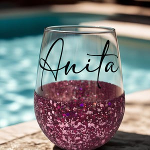 Personalized stemless wine glass with glitter-dipped bottom half, customized with any name for bridesmaids, birthdays, and special events.