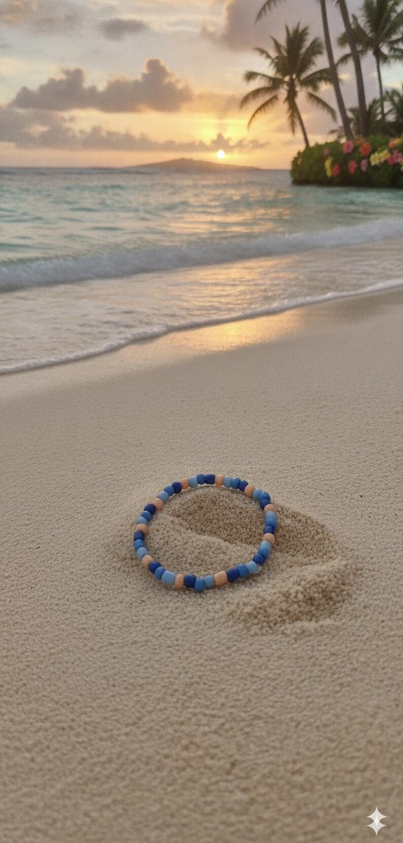 Puede incluir: Una pulsera circular compuesta por peque&ntilde;as cuentas lisas en tonos alternos de azul oscuro, azul claro y melocot&oacute;n suave. Las cuentas est&aacute;n dispuestas en un patr&oacute;n repetitivo, creando un dise&ntilde;o de bucle simple y continuo sobre la arena.