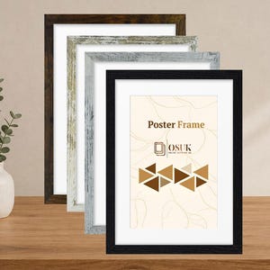 May include: A set of four rectangular poster frames in varying finishes including dark brown, distressed white, light gray, and black. The front-most black frame displays a cream-colored insert with the text Poster Frame and OSUK.