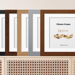 May include: A set of five square picture frames in black, dark brown, light oak, grey, and medium brown wood finishes. Each frame features a white mount and a white insert with the text Picture Frame, the OSUK logo, and MADE IN UK.