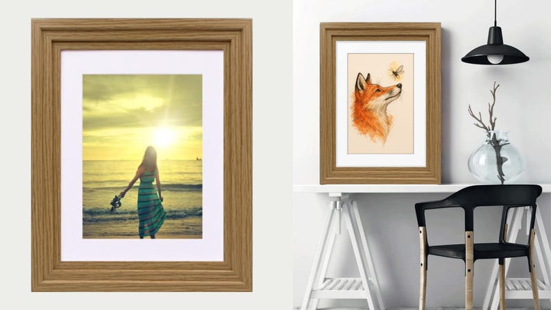 May include: A rectangular picture frame with a light brown wood grain finish and a white mat border. The frame displays a photograph of a person standing on a beach at sunset, and another version shows an illustration of a fox looking at a bee.