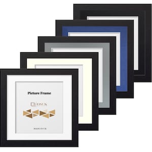 May include: A selection of black picture frames with different coloured mounts, including white, cream, grey, and blue. The frames have a simple design. The text "Picture Frame" and "MADE IN UK" are visible on the front frame.