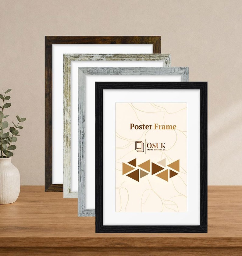May include: A set of four rectangular poster frames in varying finishes including dark brown, distressed white, light gray, and black. The front-most black frame displays a cream-colored insert with the text Poster Frame and OSUK.