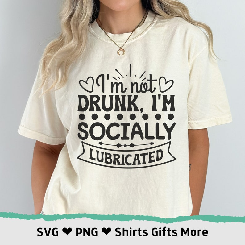 May include: A white t-shirt with the text "I'm not drunk, I'm socially lubricated" in black lettering. The text is surrounded by hearts and dots.