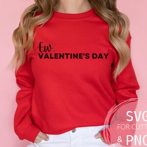 May include: Red sweatshirt with the text "Ew, Valentine's Day" in black lettering.