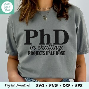 May include: Gray t-shirt with black text that reads "PhD in crafting: PROJECTS HALF DONE".