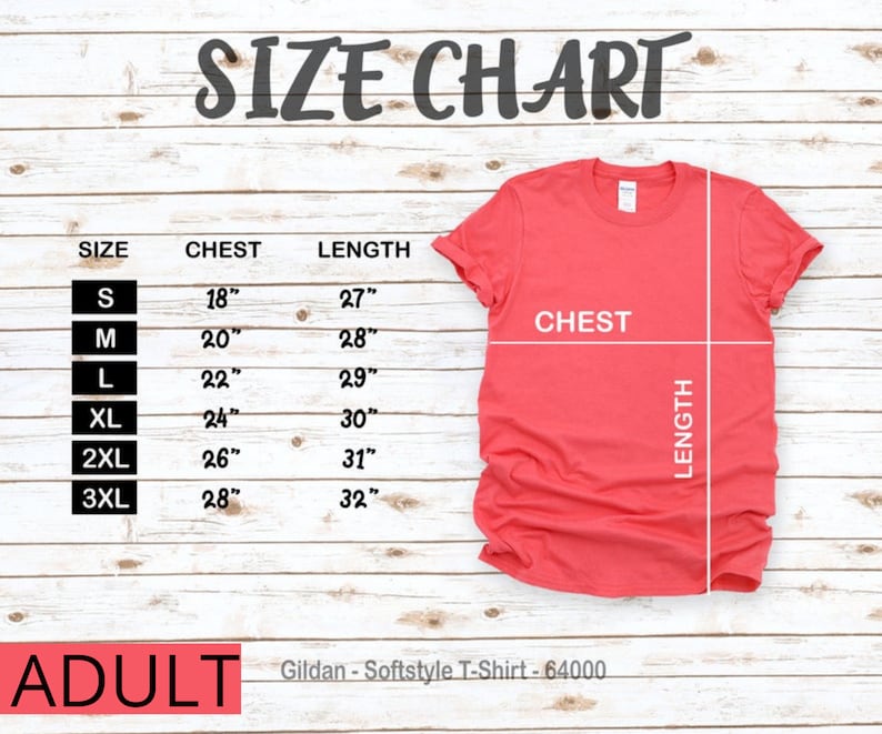 Puede incluir: Tabla de tallas para camisetas de adulto, que muestra las medidas de pecho y largo en pulgadas para las tallas S, M, L, XL, 2XL y 3XL. La tabla est&aacute; sobre un fondo de madera. Gildan - Softstyle T-Shirt - 64000