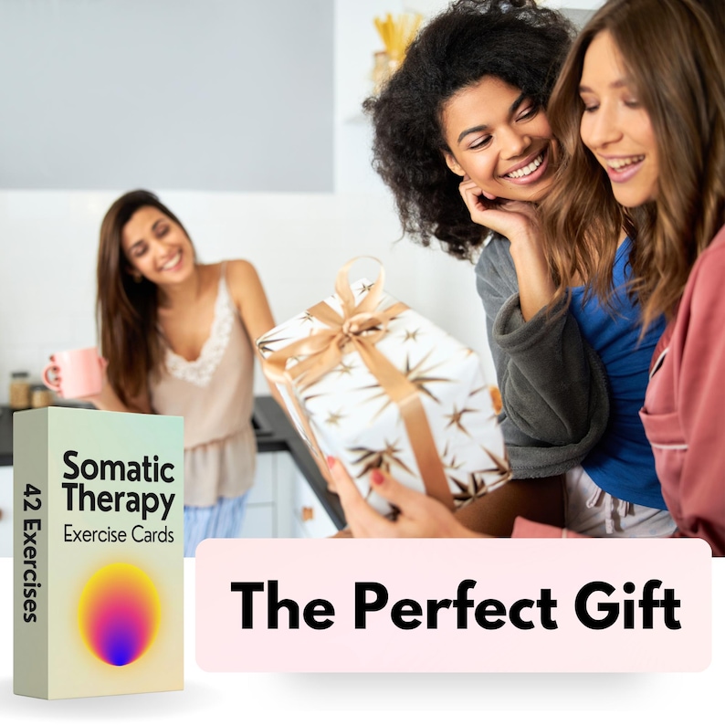 May include: A gift box wrapped in white paper with gold stars and a gold ribbon is being presented to a woman. The box is being held by another woman. The text "The Perfect Gift" is on a pink background below the image. A box of 42 Somatic Therapy Exercise Cards is shown on the left side of the image.