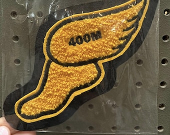 Parche personalizable con alas para pista (400 m) – Aplique con los colores de la escuela