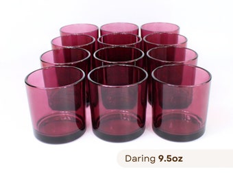 May include: Set of 12 deep purple glass tumblers, each holding 9.5 ounces. Daring 9.5oz is printed below the glasses.