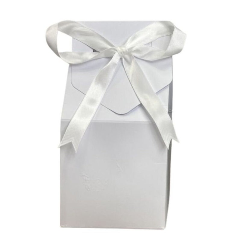 May include: A white gift box with a white satin ribbon tied in a bow.
