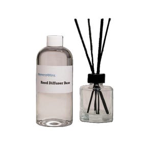 May include: A clear glass bottle with a black lid and black reeds. The bottle is labeled "GeneralWax" and "Reed Diffuser Base".