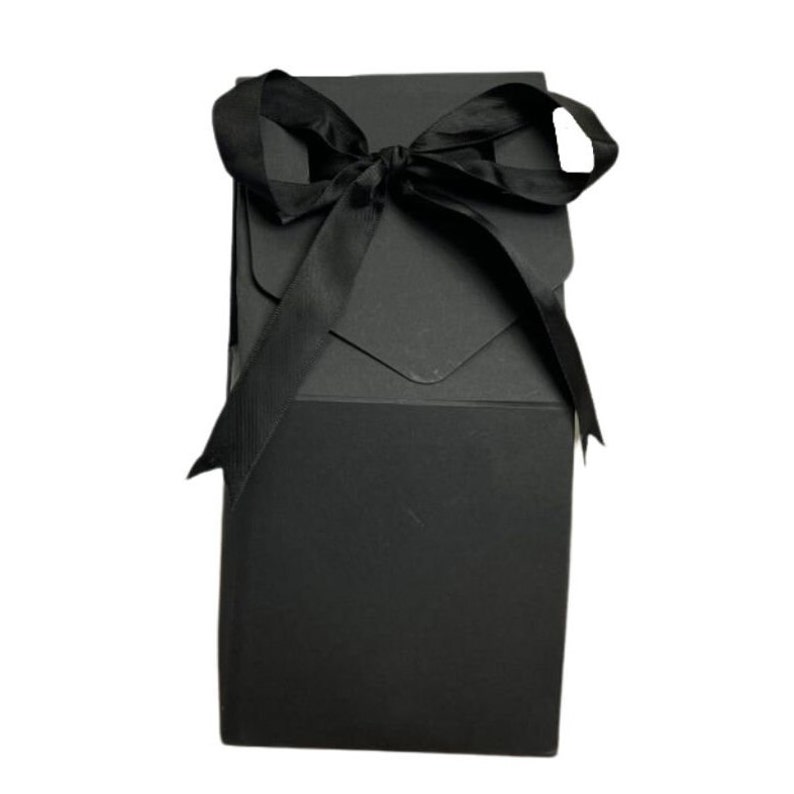 May include: A black gift box with a black satin ribbon tied in a bow on top.