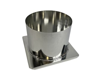 May include: A silver metal candle mold with a square base and a cylindrical top. The mold is designed for making pillar candles.