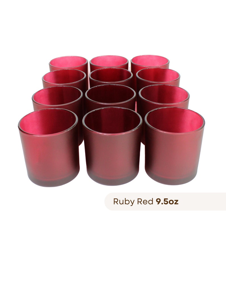 May include: Twelve ruby red glass candle jars, each holding 9.5 ounces of candle wax.