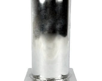 May include: A silver metal candle mold with a square base and a cylindrical top. The mold is made of sturdy metal and is designed for making candles.