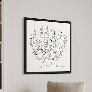May include: A black and white line drawing of a tree with a thick trunk and many branches. The drawing is framed in a black frame and hangs on a white wall.