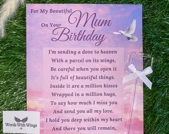 May include: A pink and purple card with a dove flying in the sky. The card says "For My Beautiful Mum On Your Birthday" and includes a poem about sending a dove to heaven with a parcel on its wings. The card is from Words With Wings UK.