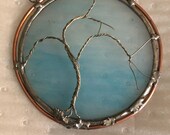 Blue glass circle with 3D wire sculpted tree