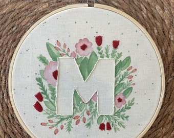 Frame embroidered and hand painted original floral monogram in customizable watercolor.