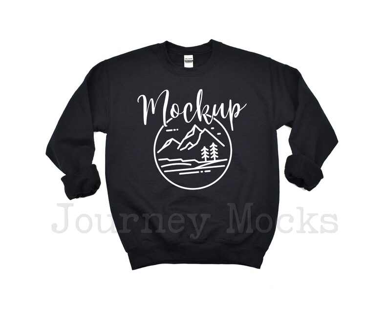May include: Black sweatshirt mockup with a white outline of mountains and trees in a circle with the word "Mockup" above it.