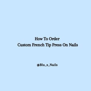 May include: Light blue background with black text that reads "How To Order Custom French Tip Press On Nails." The text "@Blu_x_Nails" is below the main text.