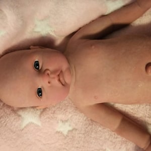 Made to order! A beautiful opened eyed soft 100% silicone baby girl. She is 20 inches long and weighs 7 lbs -5 oz
