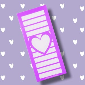 May include: A purple sticker with a heart shape cut out and seven horizontal lines. The sticker has the text "@my.secret.vanity" at the bottom.