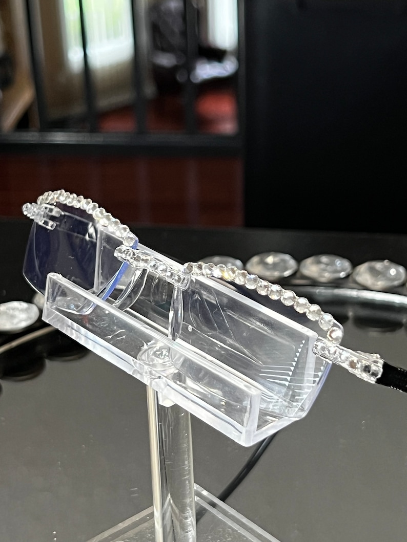 Stylish, Swarovski Reading glasses on a clear frame with black arms using pinkish AB Swarovski or silver stones on a stylish frame.