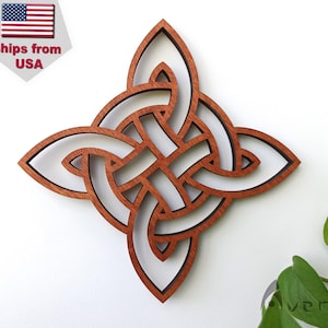 May include: A wooden Celtic knot design with a brown stain and a white background. The knot is intricate and detailed, with a four-pointed star shape.