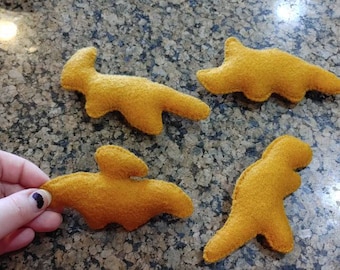 Giocattolo per gatti in feltro con erba gatta Dino Nuggets