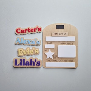 May include: A wooden first day of school board with a magnetic strip and space to write the date, things I love, and what I want to be. Includes name tags for Carter, Alexa, Evie, and Lilah.
