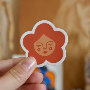 Orange Flower With Face Vinyl Sticker