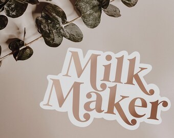 May include: A white sticker with the words "Milk Maker" in a brown, cursive font.