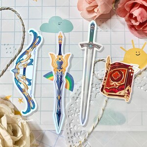 May include: A collection of fantasy-themed stickers featuring a bow and arrow, two swords, and a book. The bow and arrow are blue and gold. The swords have silver and blue blades. The book is red and gold.