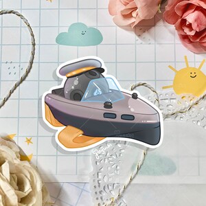 May include: A cartoon illustration of a gray and white speedboat with a black and white round object in the front. The boat has a yellow and orange bottom and a blue windshield.