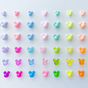 May include: A rainbow assortment of Mickey Mouse shaped beads in various finishes, including mini pastel, matte pastel, glossy pastel, jelly, clear, and bright.