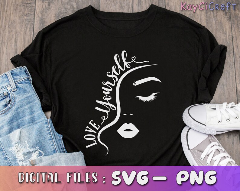 May include: Black t-shirt with a white graphic design of a woman's face and the text "Love Yourself".