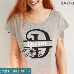 May include: A gray t-shirt with a black floral design and the word "Dream" in a split monogram style.