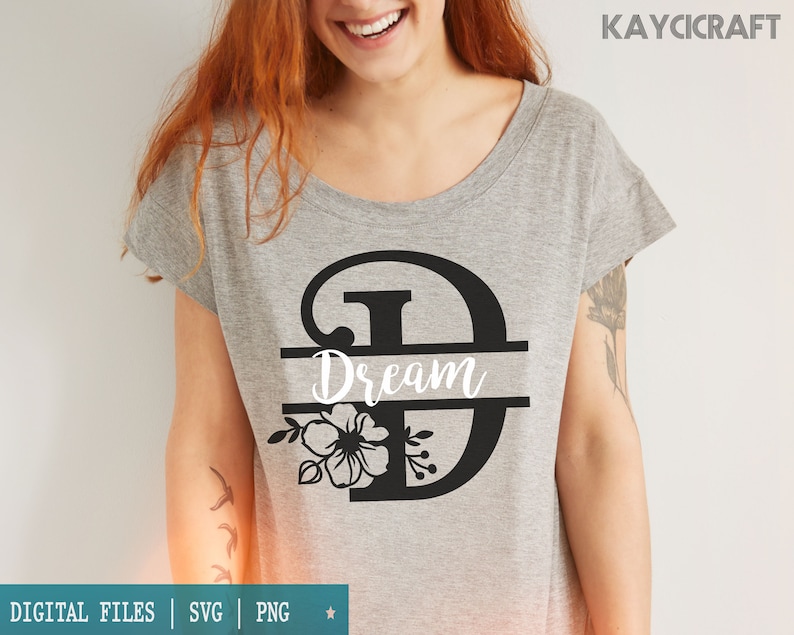 May include: A gray t-shirt with a black floral design and the word "Dream" in a split monogram style.