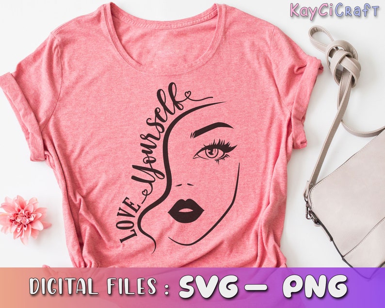 May include: Pink t-shirt with a black and white graphic design of a woman's face and the text "LOVE YOURSELF".