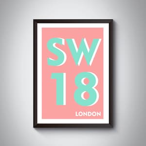 May include: A framed print with a pink background and the text "SW18 LONDON" in white and turquoise letters.