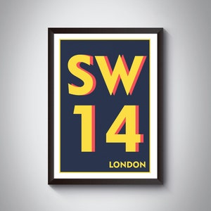 May include: A framed poster with a navy blue background and yellow text that reads "SW14 LONDON". The text is outlined in red.