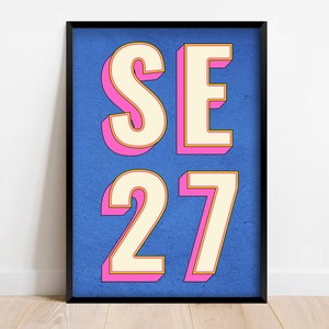 May include: A blue poster with the text "SE 27" in white letters with pink and yellow outlines.